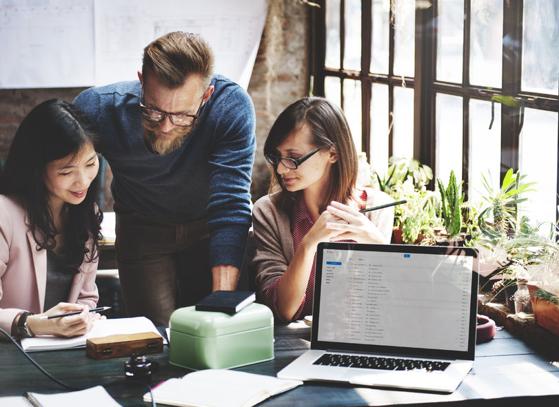49845360 – business team corporate marketing working concept three people looking at a project together