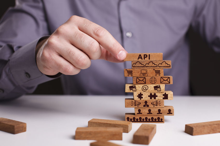The concept of technology, the Internet and the network. Busines API wood blocks