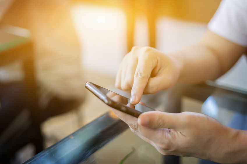 banner_ads person using phone